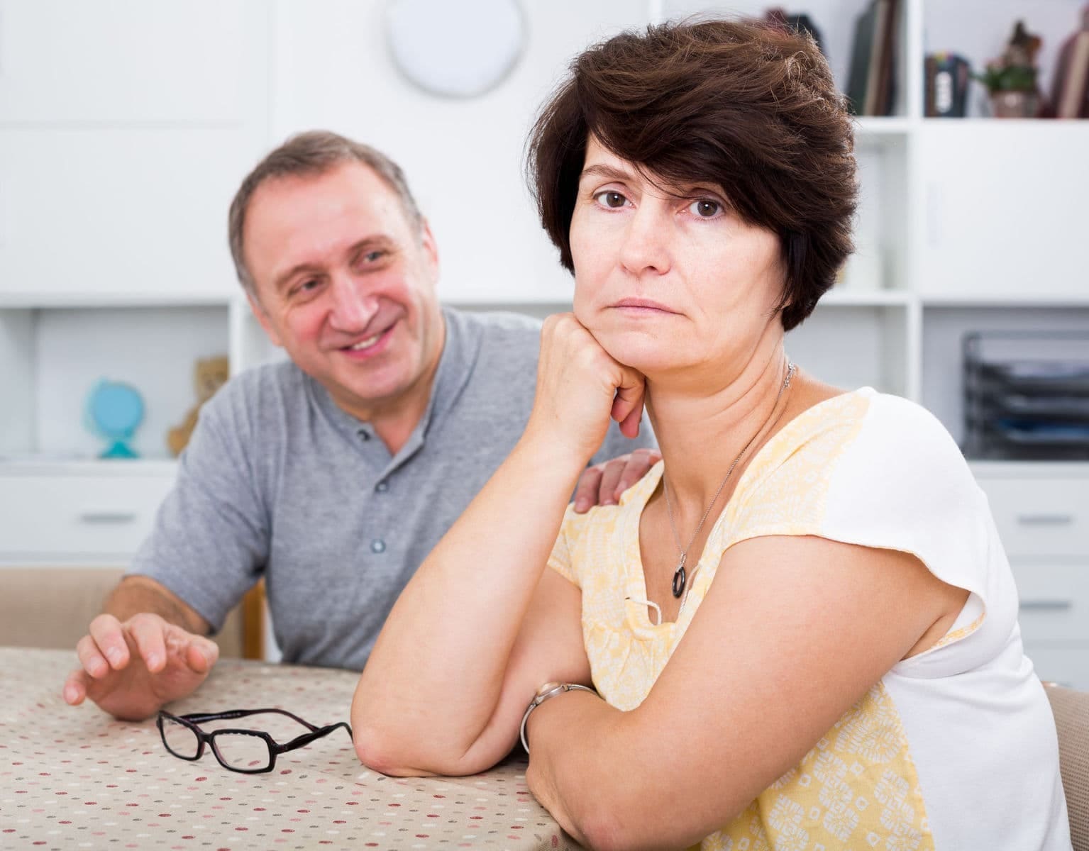 Woman feeling over whelmed trying to put a brave face on