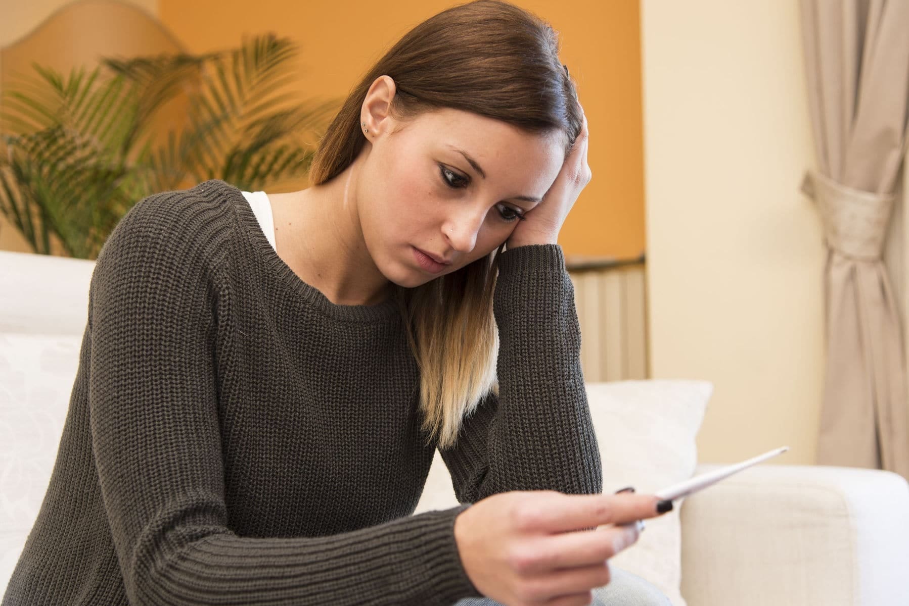 Woman stressed with bills which is affecting her mental health