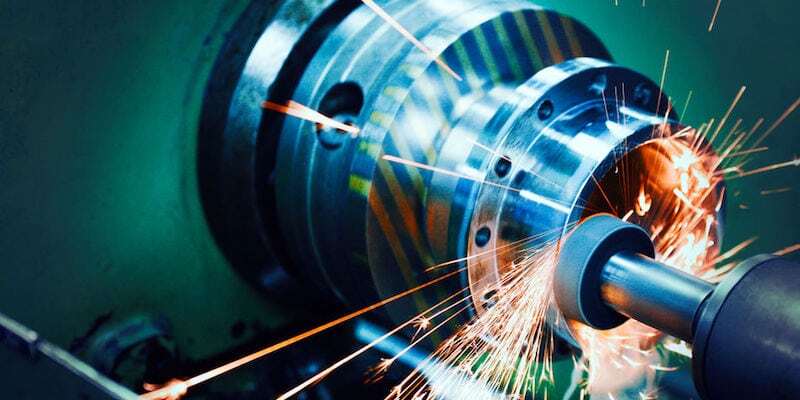 sparks flying while machine griding and finishing metal