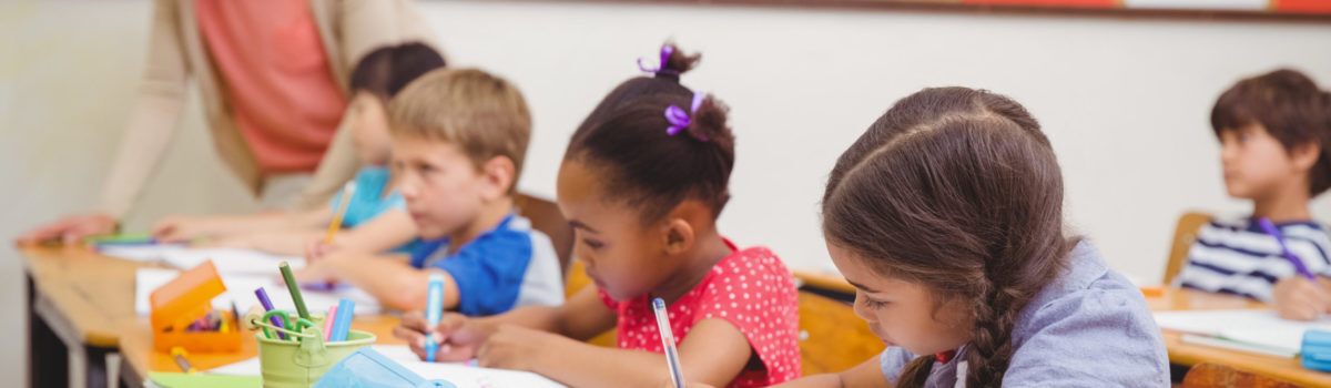 Teacher monitoring student progression in the classroom Teacher monitoring student progression in the classroom