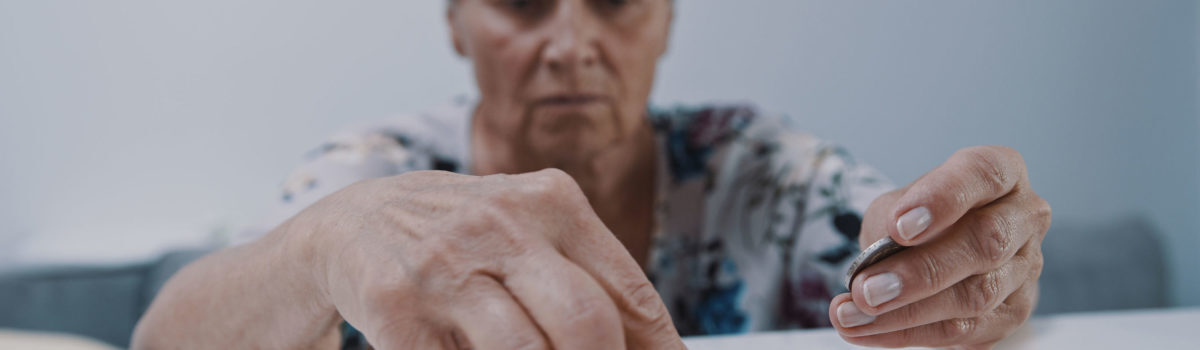 Elderly vulnerable lady suffering from neglect counting her money Elderly vulnerable lady suffering from neglect counting her money