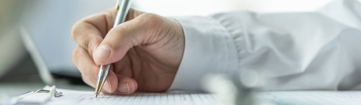 Someone Writing Out and Planning Their Personal Development Plan Someone Writing Out and Planning Their Personal Development Plan